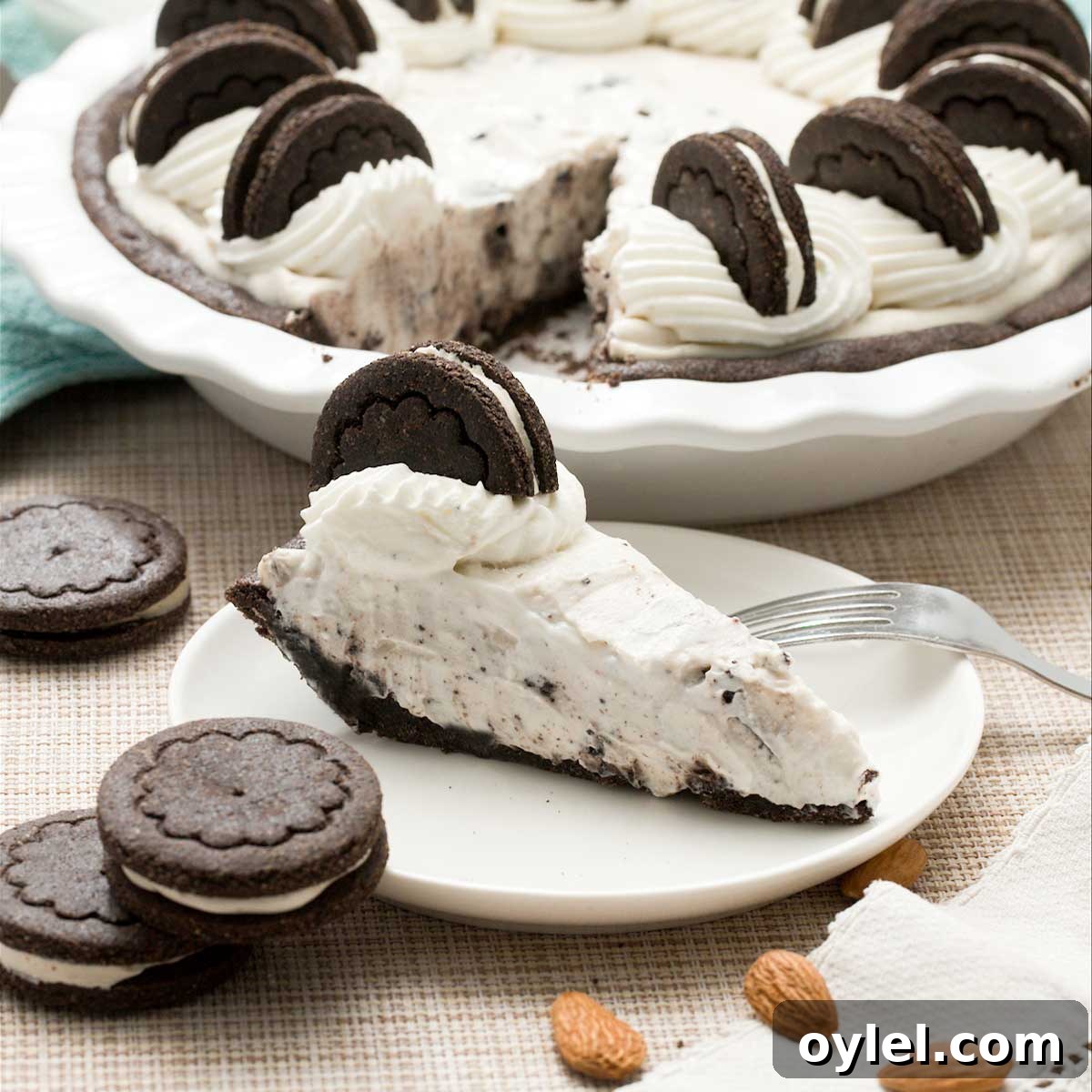 Gluten Free Cassava Flour Chocolate Chip Cookies Recipe 9 A gluten-free oreo cream pie with whipped cream on top and a slice on a plate.