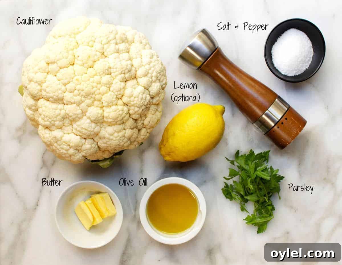 grilled cauliflower steak recipe ingredients on a marble board