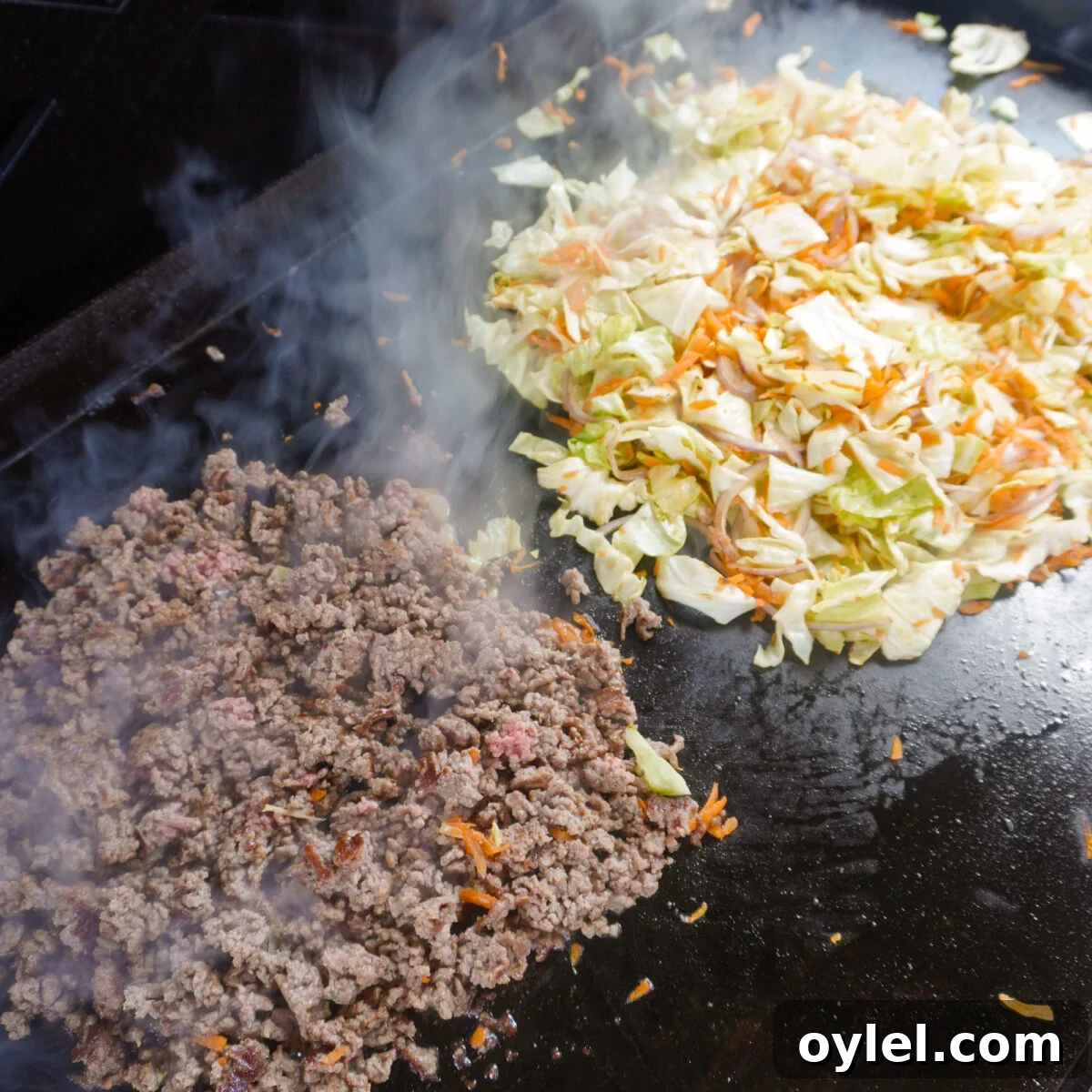 Ground Beef Egg Roll Bowl Recipe 5 cooked ground beef and veggies on griddle.