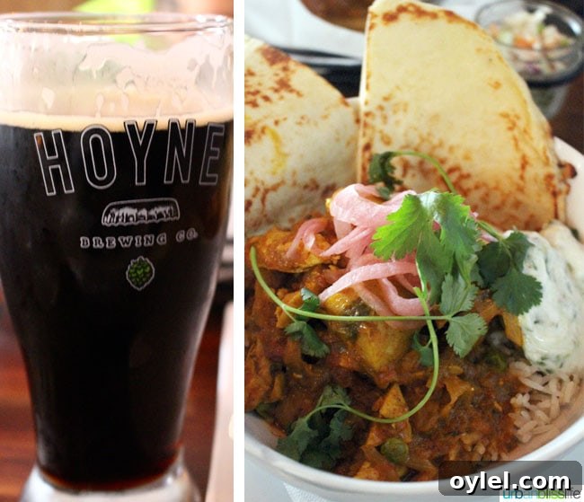 large stout beer and the curry bowl at 10 Acres Commons restaurant in Victoria BC Canada.