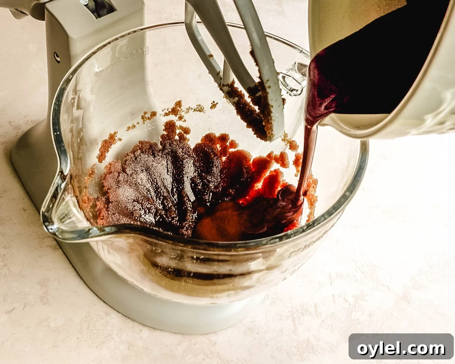 Add cocoa coffee paste to the mixing bowl.