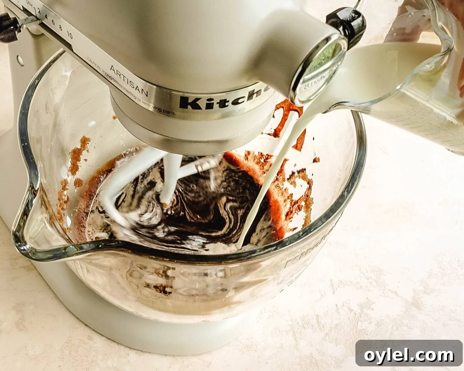 Add milk to the batter.