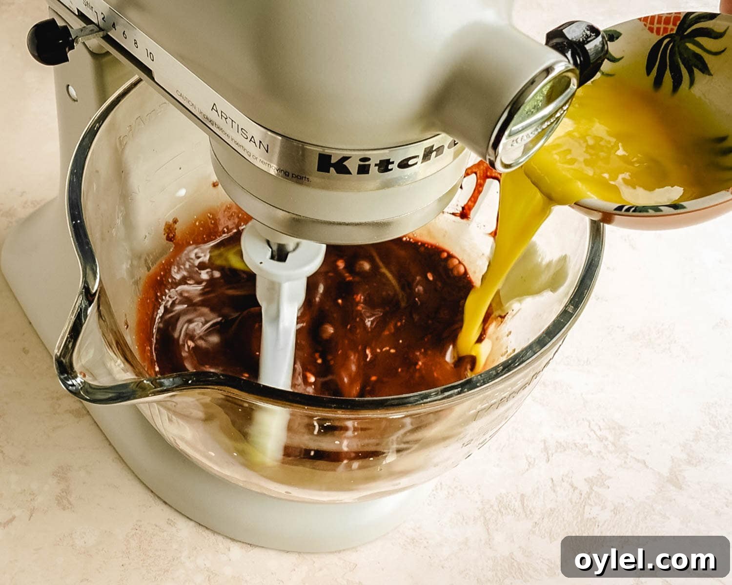 Add beaten eggs to the batter.