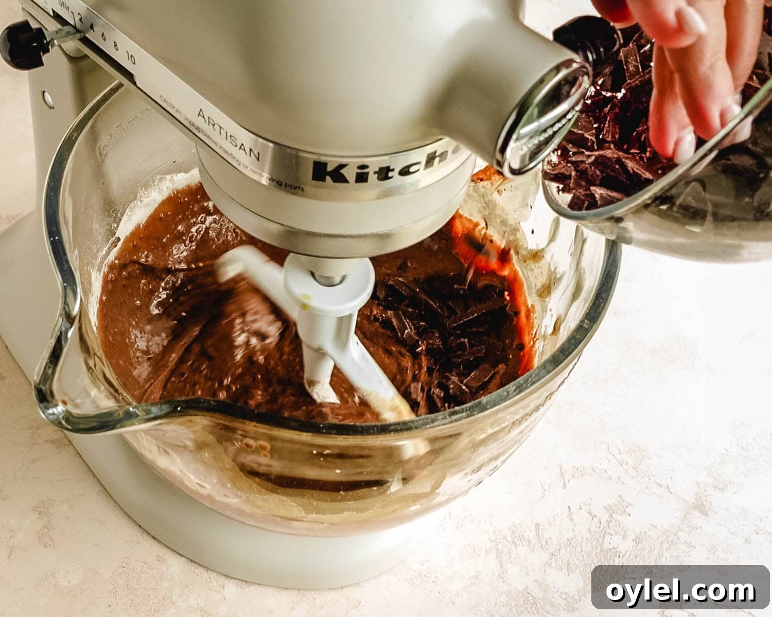 Stir in chocolate chunks to the muffin batter.