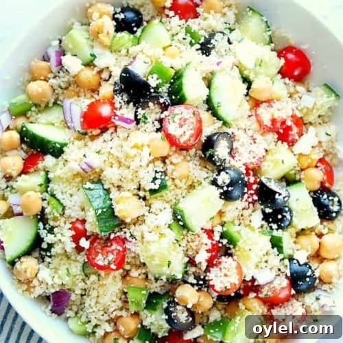Couscous salad with cucumbers in a bowl.