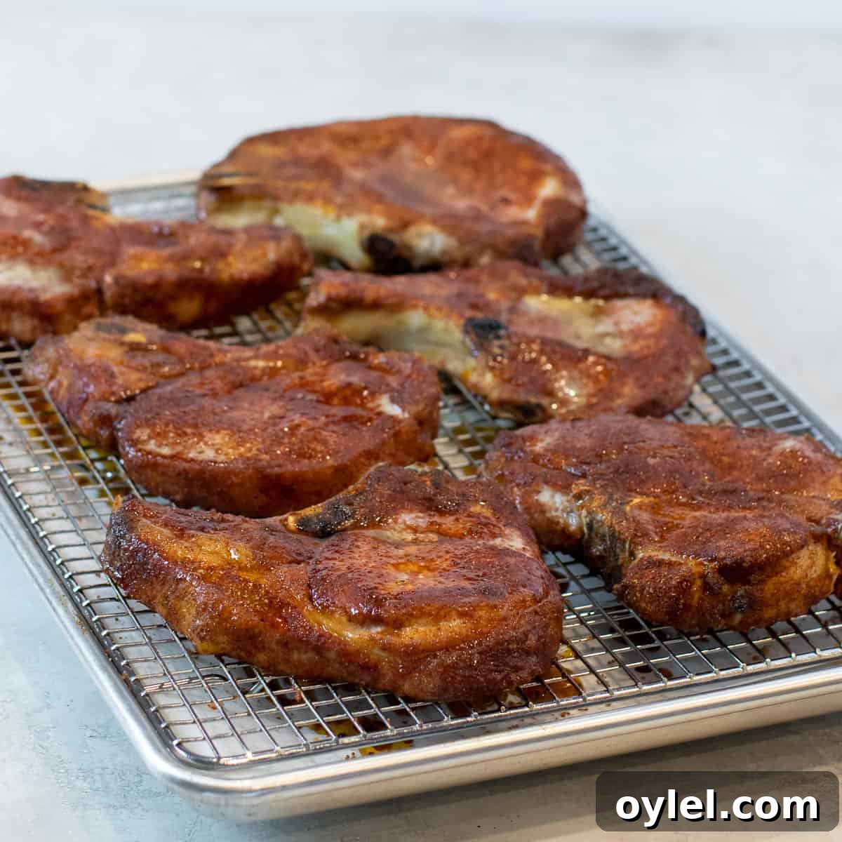 A baking sheet of chops that are done and ready to eat.