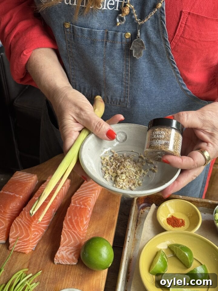 Coconut Curry Salmon in Creamy Fragrant Broth 4 a photo of teri holding dried lemongrass