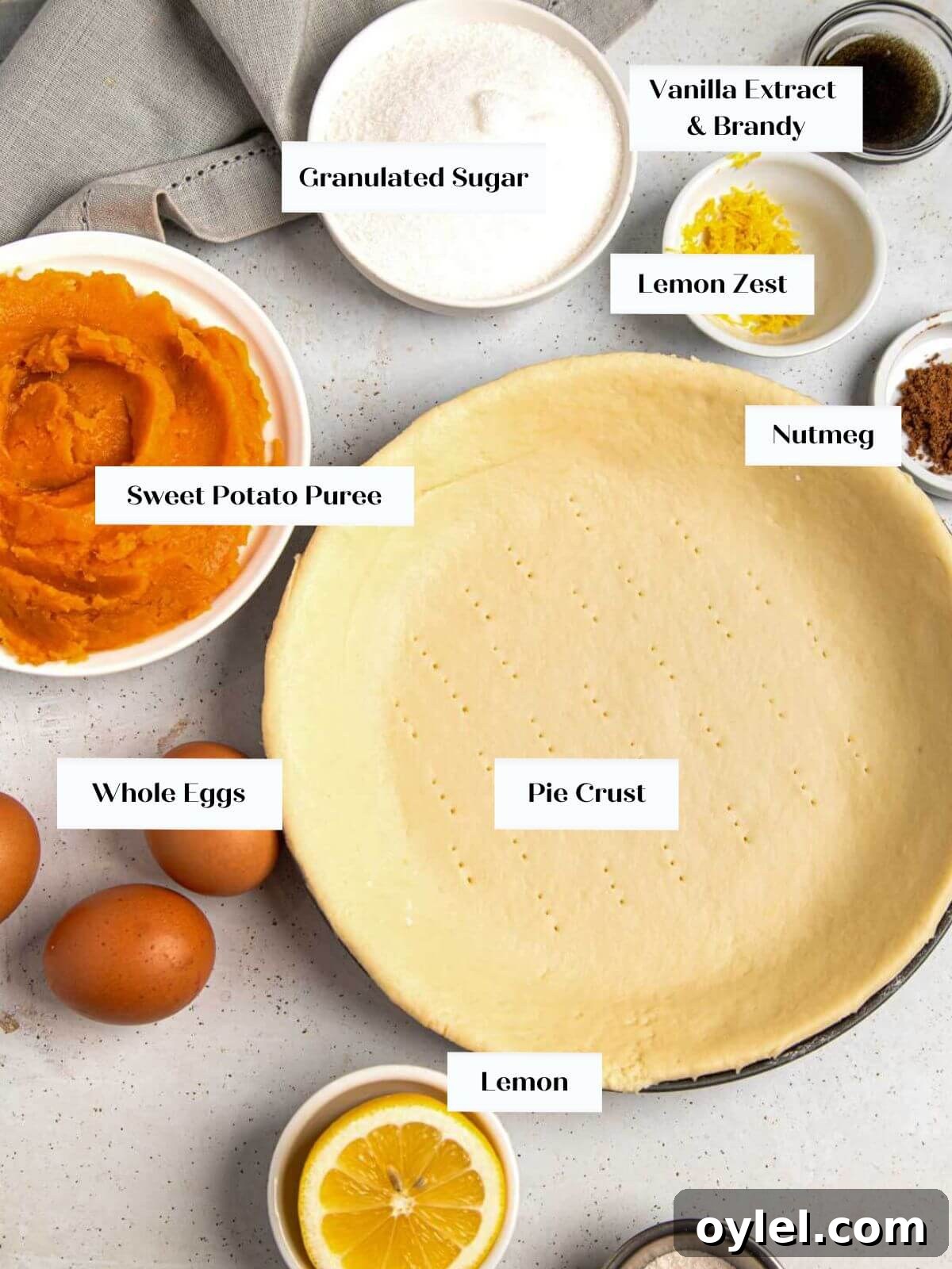 Classic Southern Sweet Potato Pie Recipe with Spiced Filling 3 sweet potato pie ingredients on white surface.