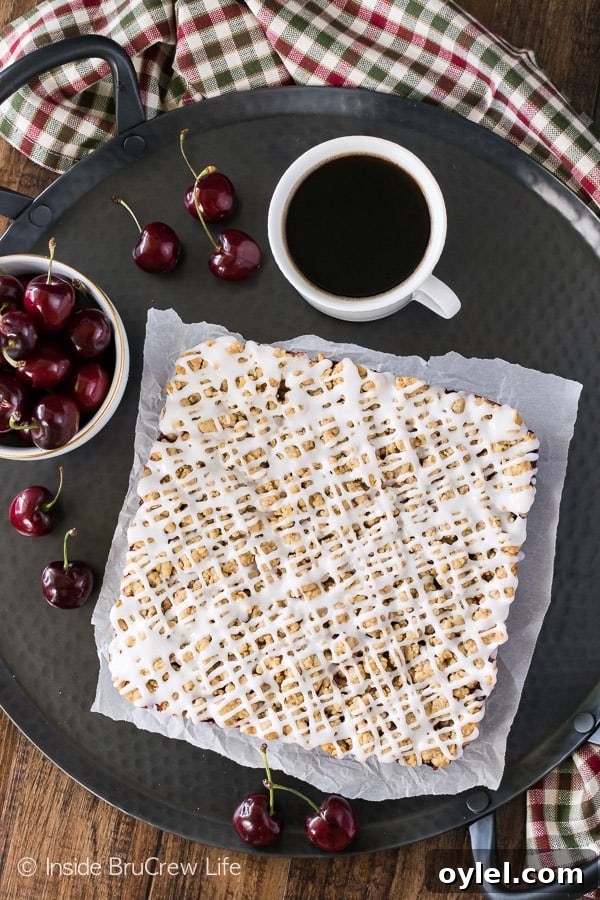 Cherry Apple Crumble Bars - spice crumbles, fruit filling, and a glaze make these a fun summer dessert! Great recipe for picnics! Cherry Apple Crumble Bars - spice crumbles, fruit filling, and a glaze make these a fun summer dessert! Great recipe for picnics!