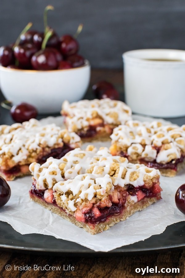 Cherry Apple Crumble Bars - a drizzle of glaze holds these crumbly fruit bars together. Great recipe for summer picnics! Cherry Apple Crumble Bars - a drizzle of glaze holds these crumbly fruit bars together. Great recipe for summer picnics!