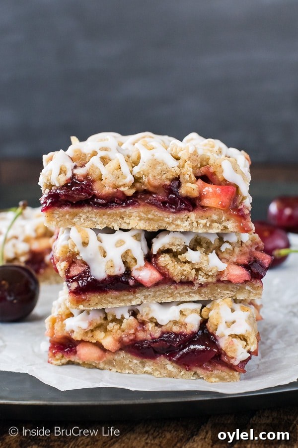 Cherry Apple Crumble Bars - sweet cherry preserves and apple chunks add a great flavor to this easy crumble bar! Great recipe for summer picnics! Cherry Apple Crumble Bars - sweet cherry preserves and apple chunks add a great flavor to this easy crumble bar! Great recipe for summer picnics!