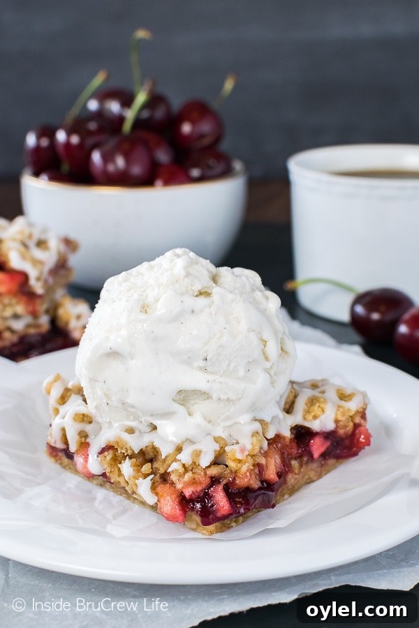 Cherry Apple Crumble Bars - these easy fruit bars taste so good if you serve them with ice cream! Great recipe for summer picnics or parties! Cherry Apple Crumble Bars - these easy fruit bars taste so good if you serve them with ice cream! Great recipe for summer picnics or parties!