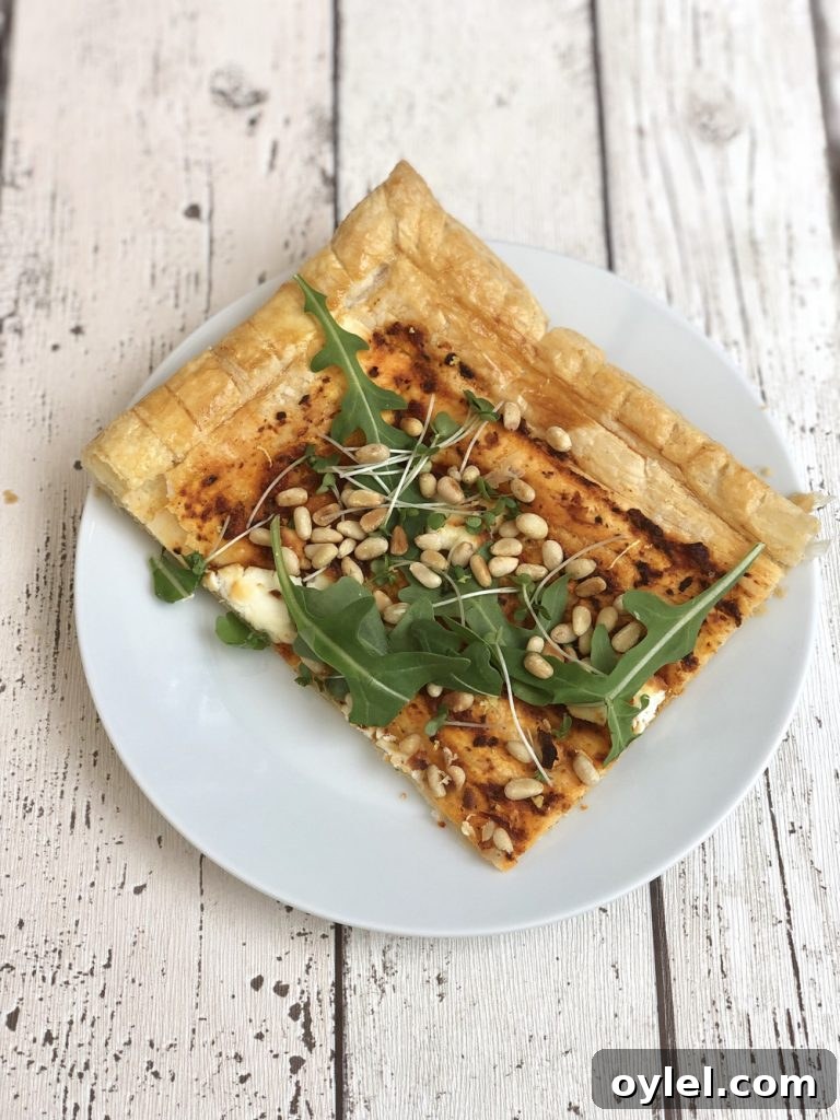 goat cheese tart with rocket and pine nuts.
