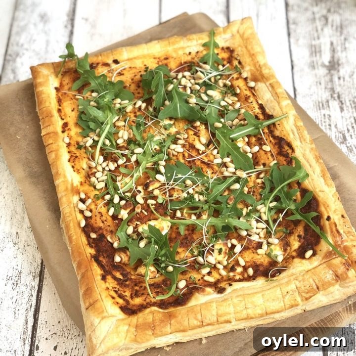 goat cheese tart with rocket and pine nuts.