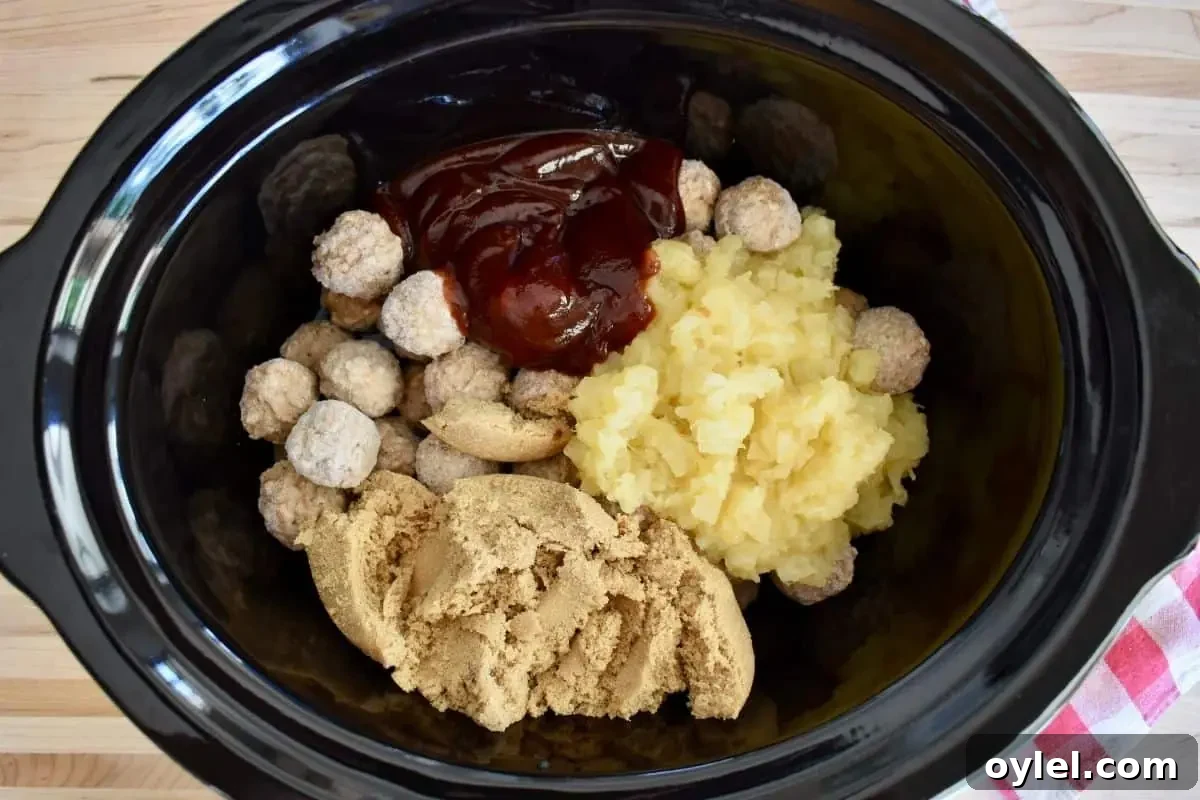4-Ingredient Slow Cooker Hawaiian Meatballs 5 All of the ingredients in a large crock pot.