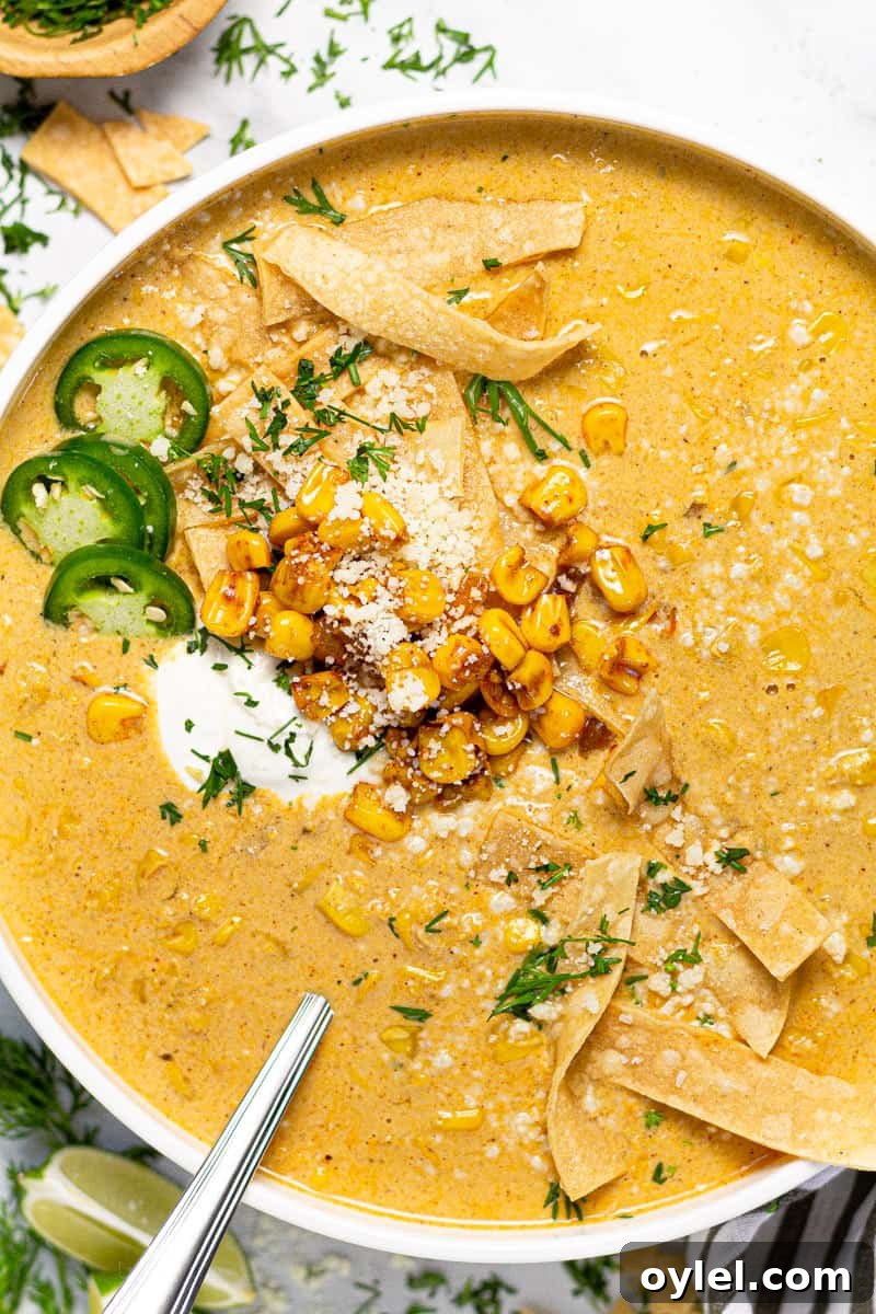 Creamy Elote Soup (Mexican Street Corn) 2 Large white bowl of creamy corn soup garnished with tortilla strips