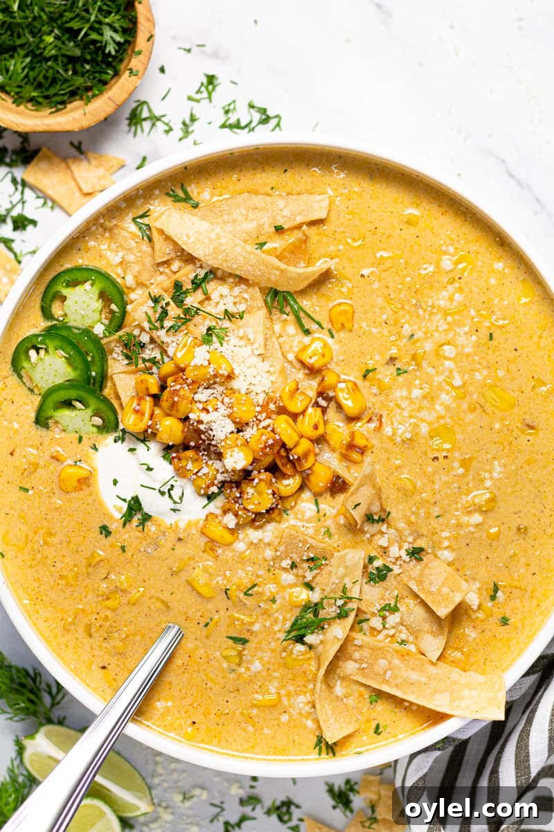 Creamy Elote Soup (Mexican Street Corn) 6 Large white bowl of creamy corn soup garnished with tortilla strips