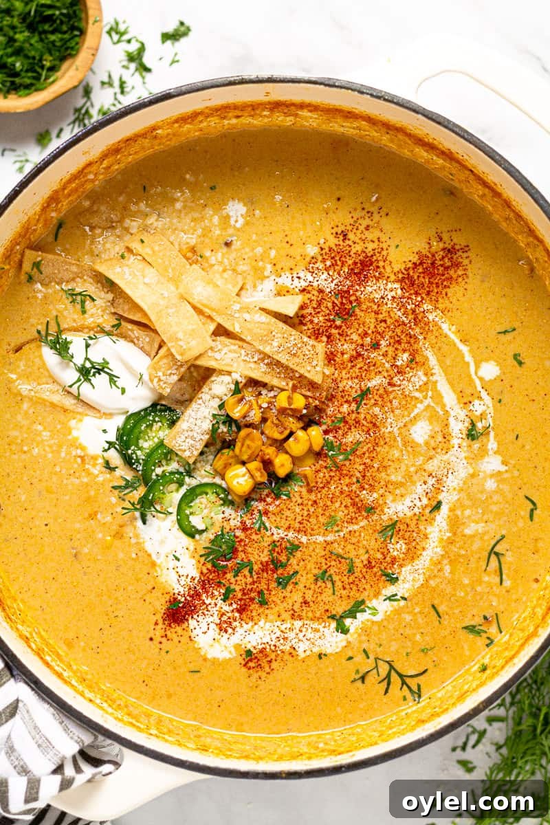 Creamy Elote Soup (Mexican Street Corn) 3 Large white pot of creamy corn soup garnished with tortilla strips