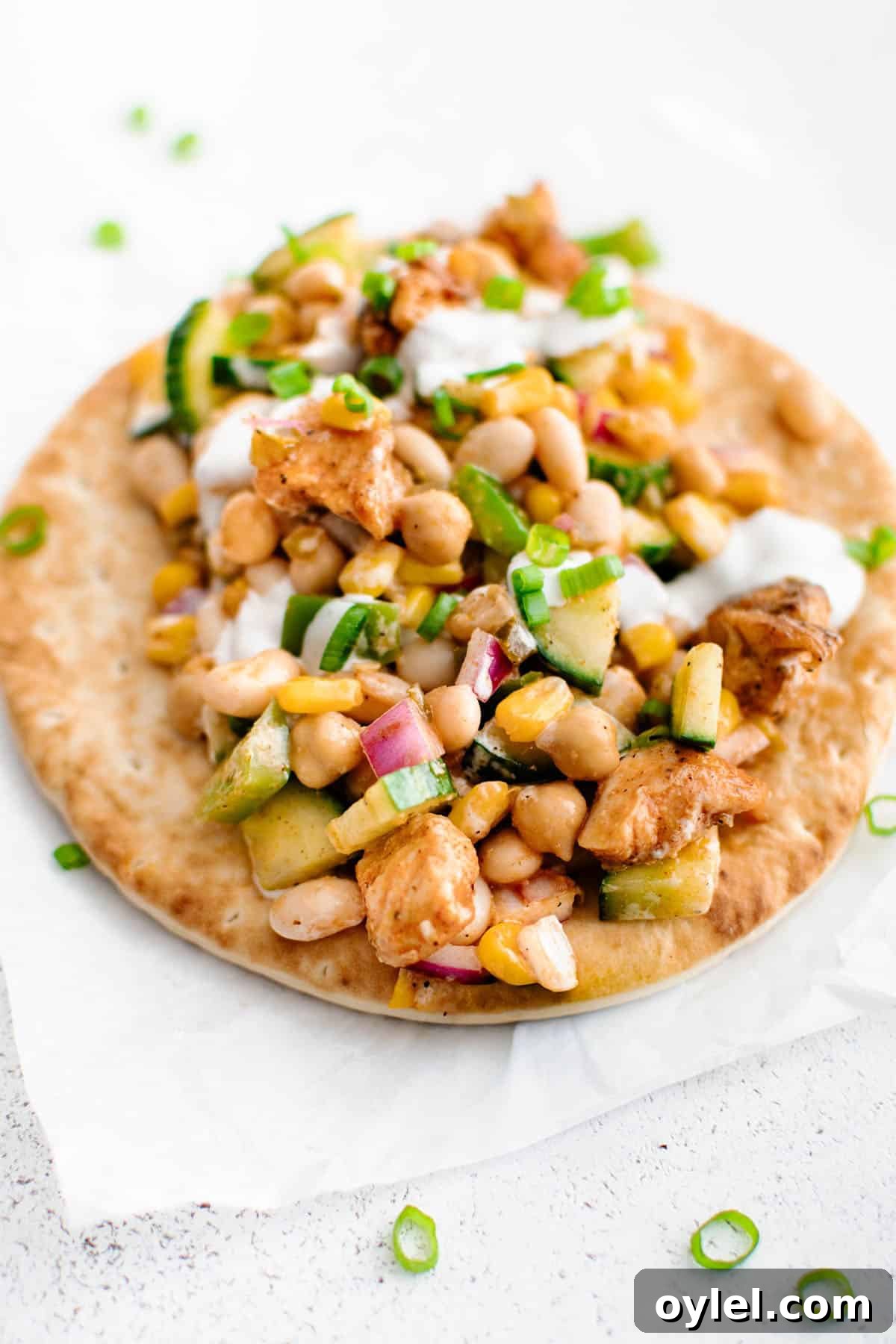 Buffalo Chicken Bean Salad on top of a flatbread