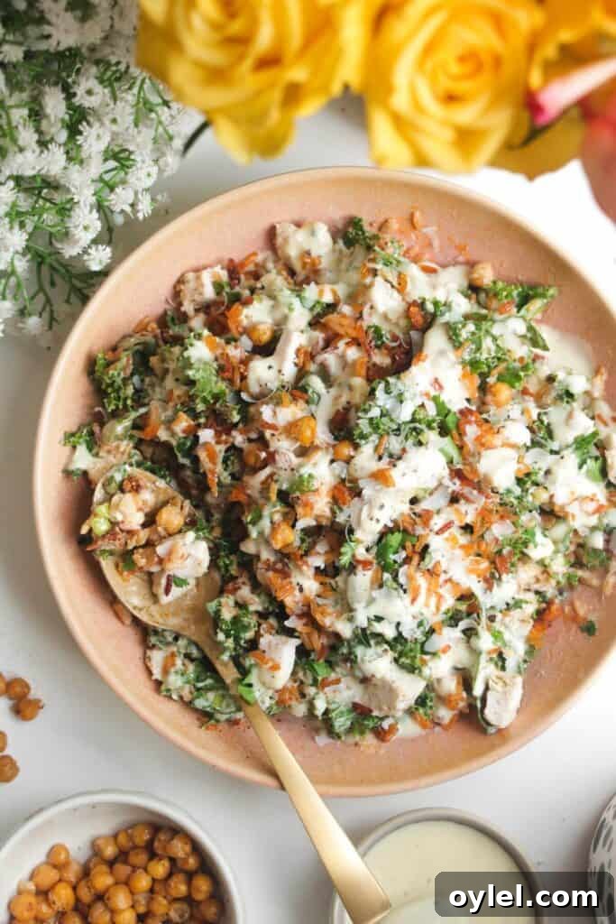 Chicken Shawarma Salad with Crispy Rice 14 Caesar crispy rice salad in a pink bowl.