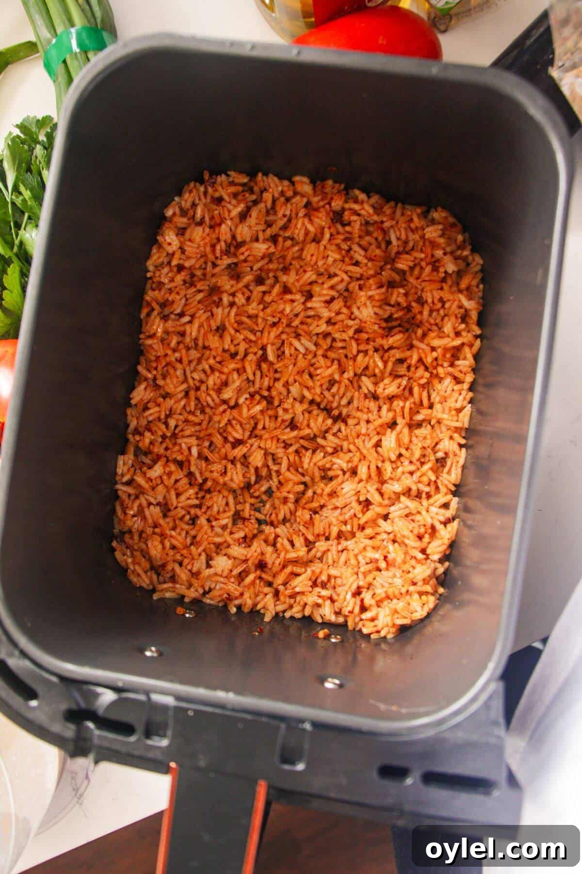 Chicken Shawarma Salad with Crispy Rice 7 Rice in air fryer basket.