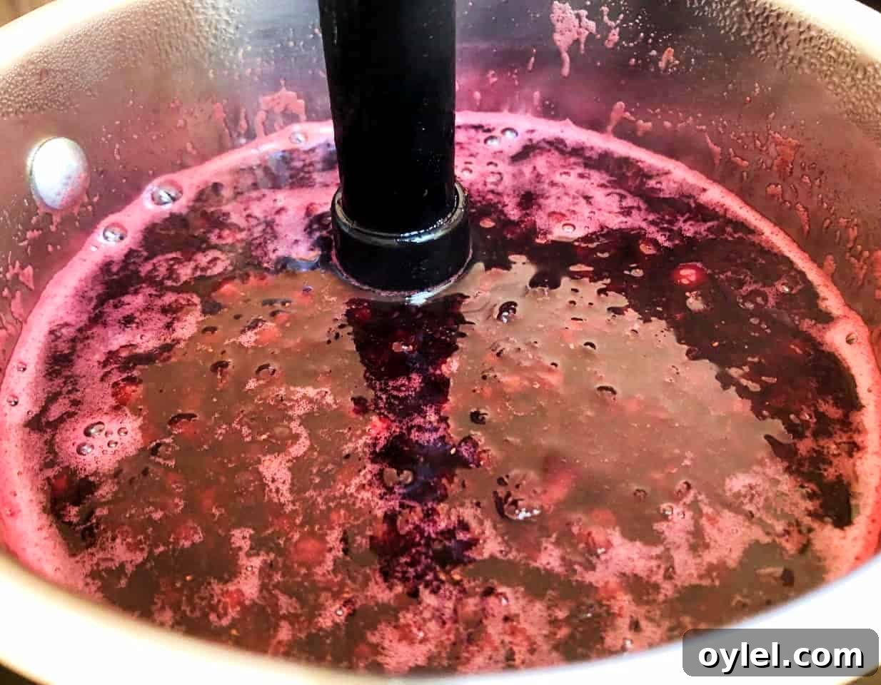 huckleberry syrup in a saucepan.