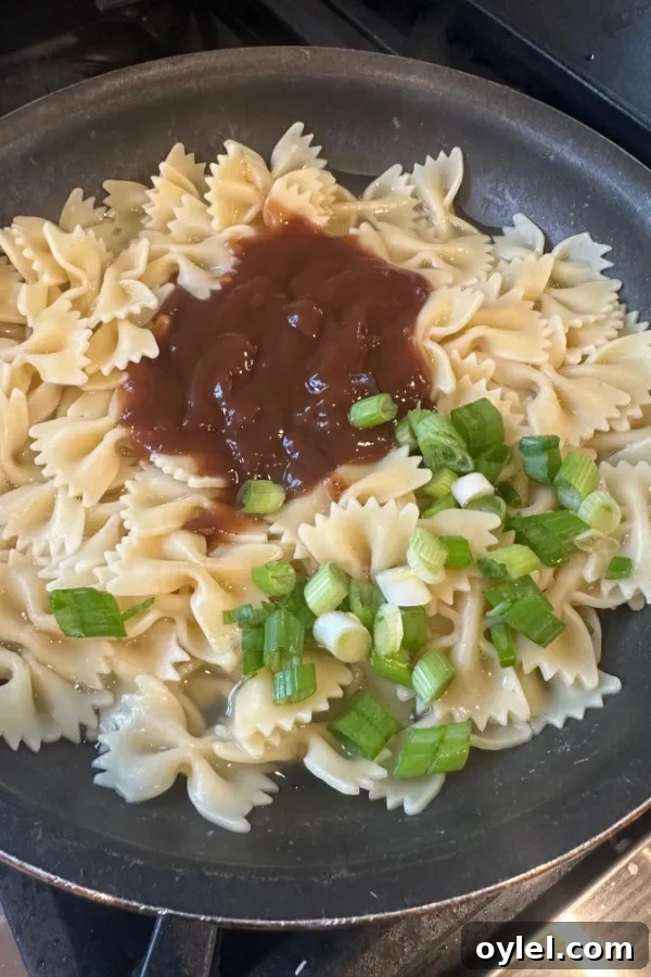 Cheesy Barbecue Chicken Skillet Recipe 4 bow tie pasta with barbecue sauce and green onions