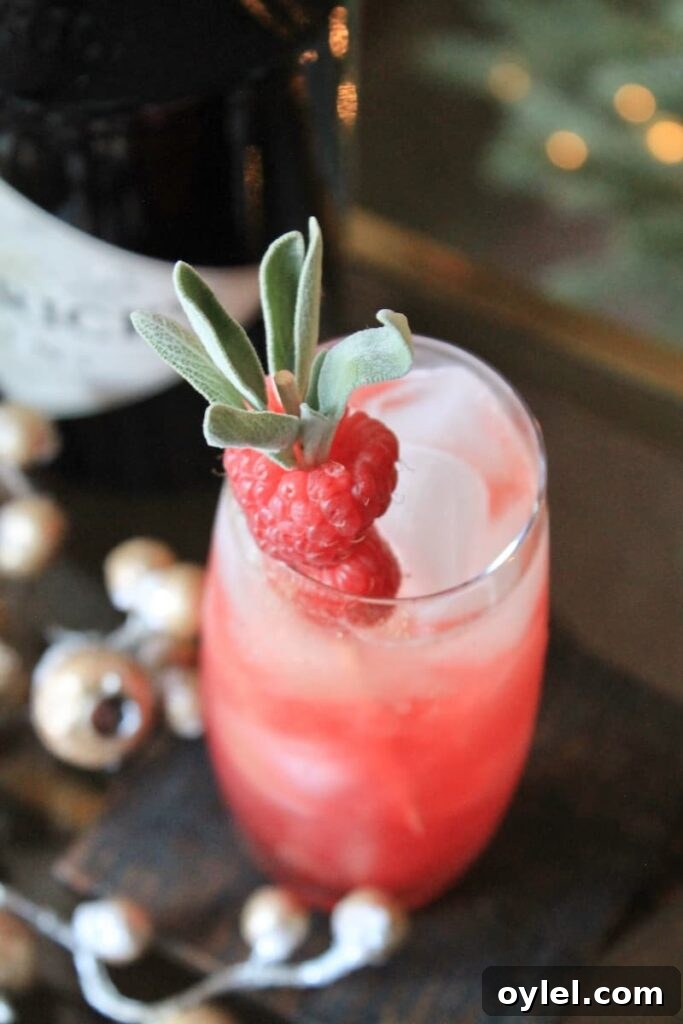 easy chambord champagne cocktail with gin raspberries and sage