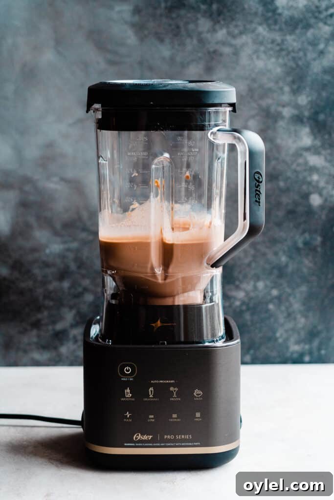 Creamy Homemade Peanut Butter Chocolate Milkshake 4 The blender with the blended milkshakes.