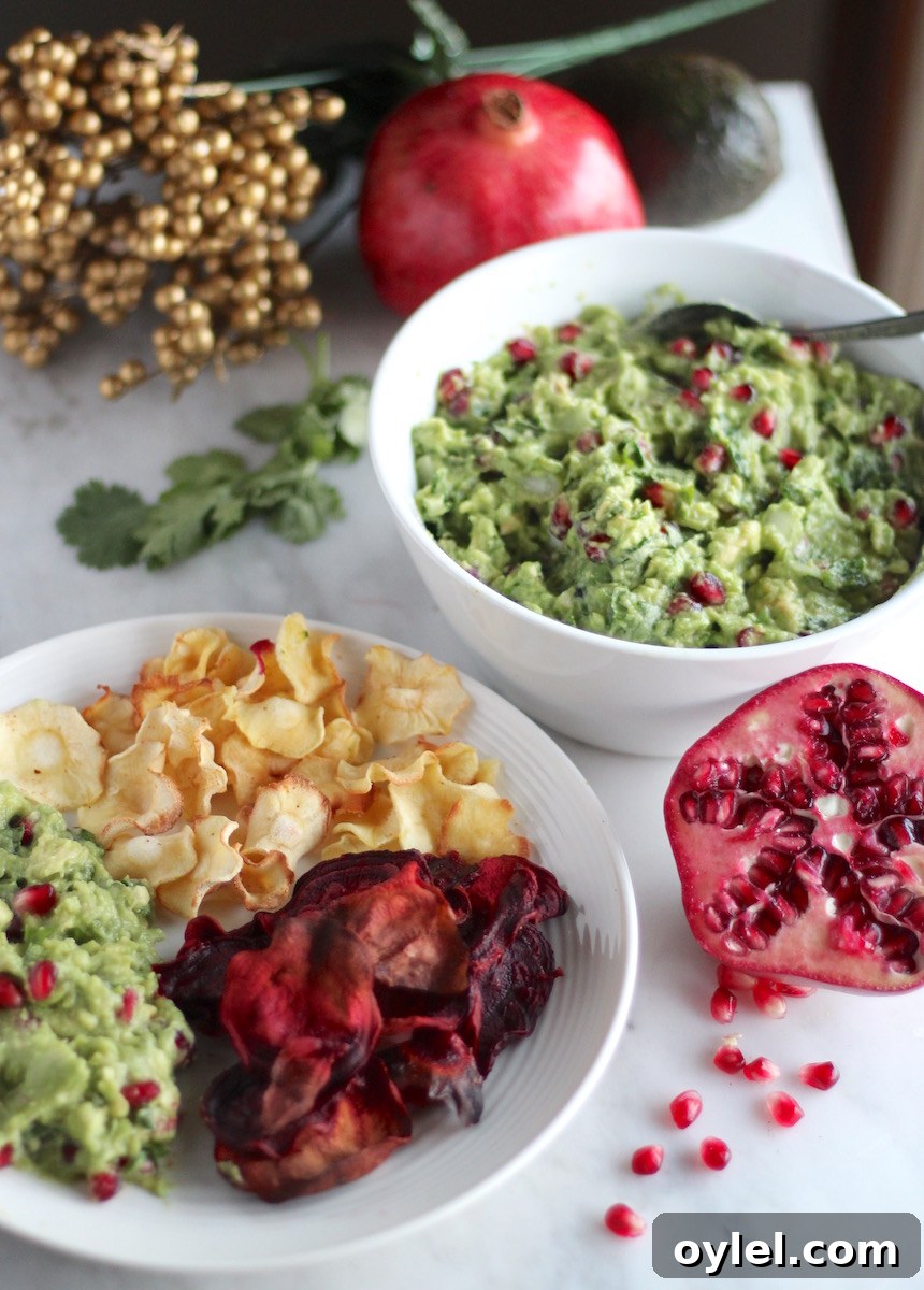 AIP Pomegranate Guacamole - a luscious, colorful guacamole that features tart pomegranate seeds, sweet orange juice, and fresh cilantro! SO good! | fedandfulfilled.com