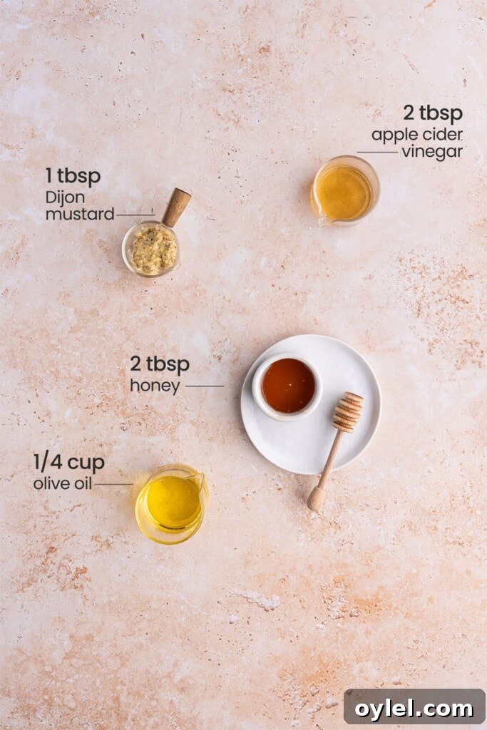Ingredients for honey Dijon vinaigrette - apple cider vinegar, Dijon mustard, honey, olive oil.