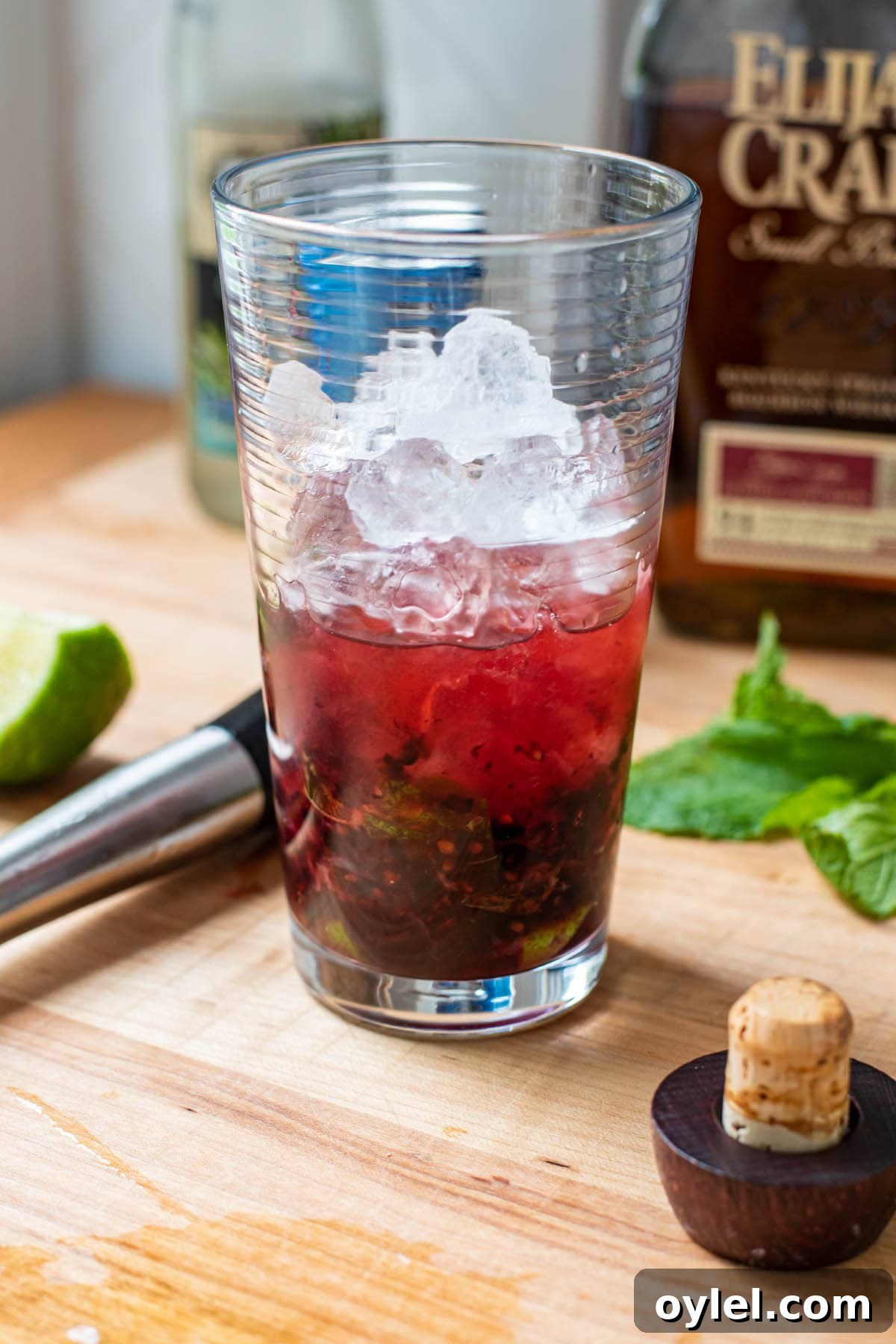 Blackberry Bourbon Smash Cocktail Recipe 6 Pouring a blackberry bourbon smash