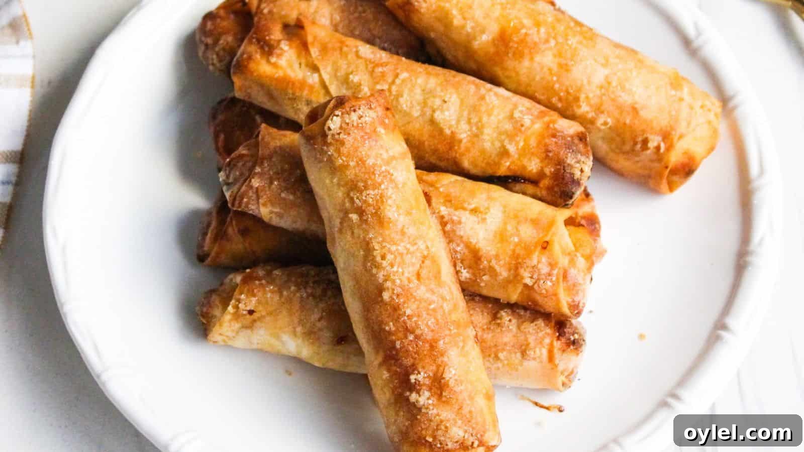 13 Asian Recipes You Won't Believe Are This Simple 3 A plate of freshly cooked Filipino banana turon lumpia spring rolls.