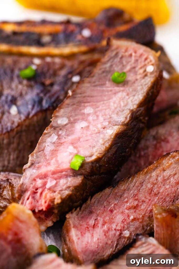 Close shot of slices of juicy Asian style grilled rib-eye steak.