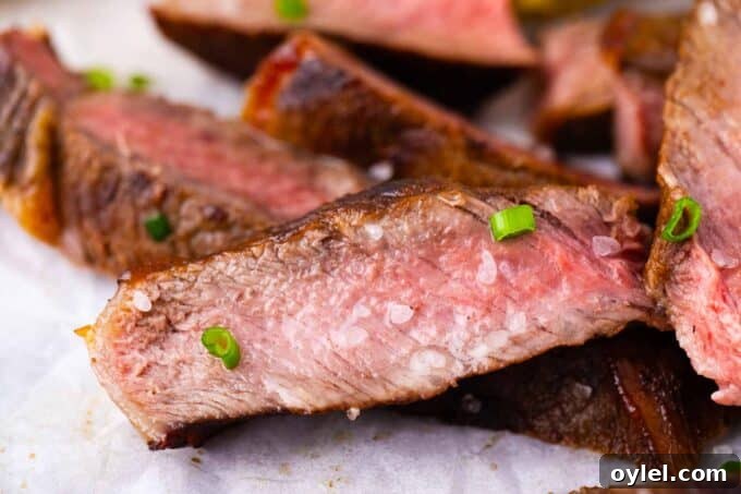Sliced Asian style grilled steak topped with sea salt.