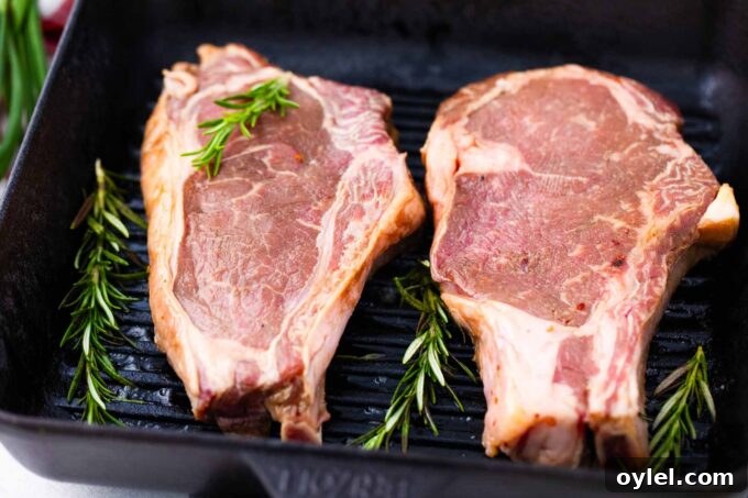 Asian style marinated steaks being cooked on a grill pan.