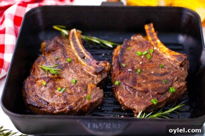 Cooking two ribeye steaks in a grill pan.