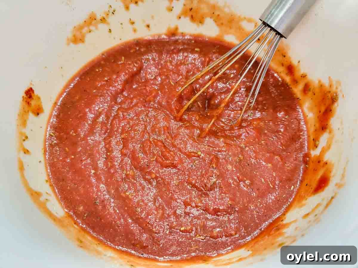 5-Minute Pizza Sauce Recipe: Quick Homemade Tomato Sauce 3 5 Minute Pizza Sauce whisked in a bowl.