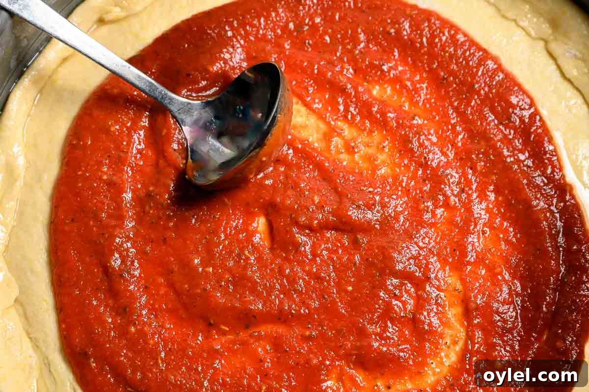 5-Minute Pizza Sauce Recipe: Quick Homemade Tomato Sauce 4 5 Minute Pizza Sauce spread on pizza dough.