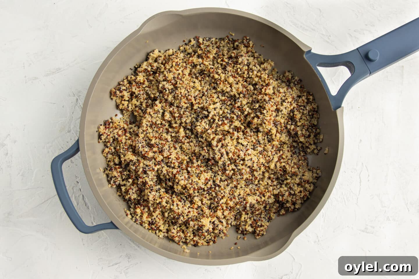 Cooked quinoa in skillet.