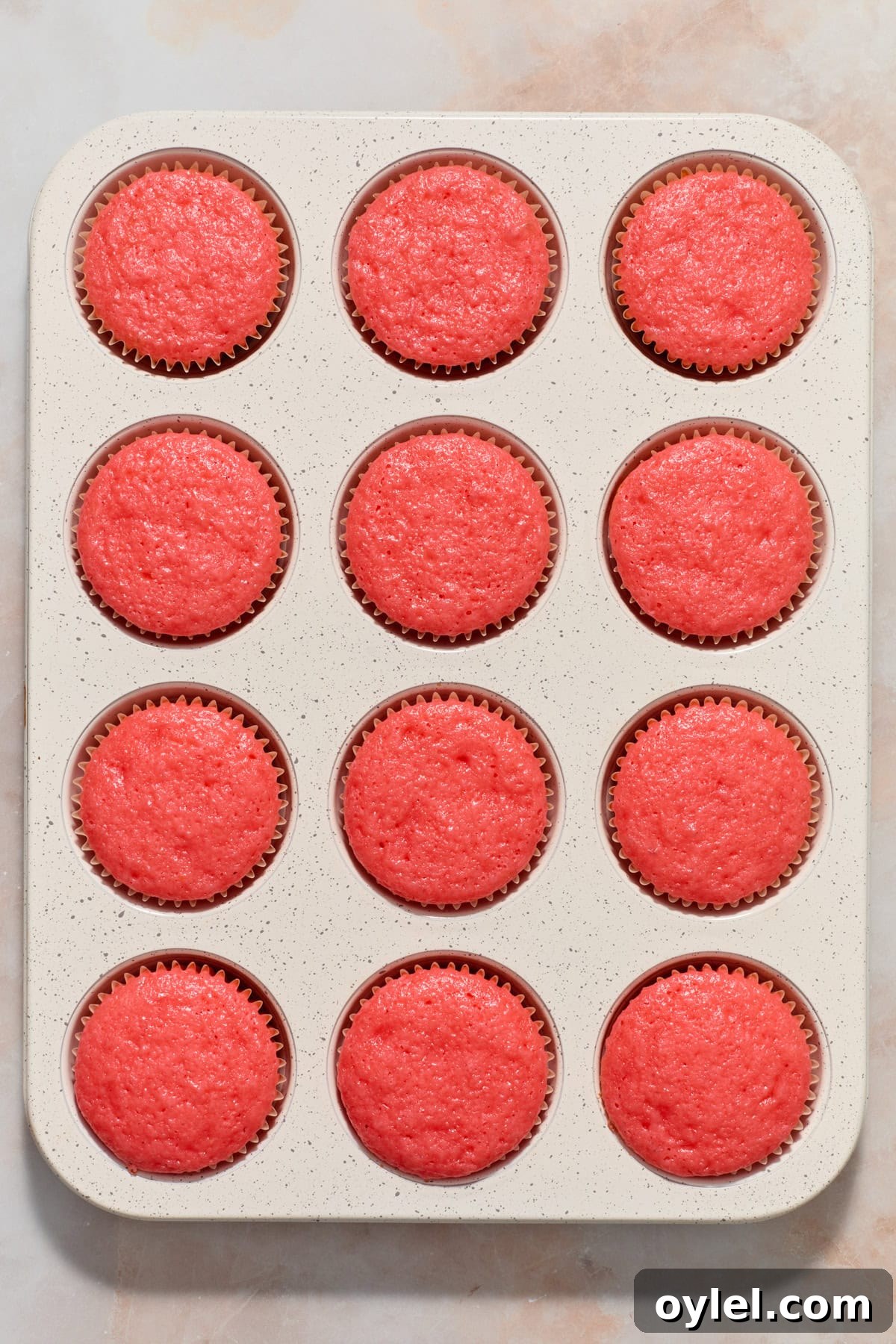 Strawberry Crunch Cupcakes Recipe with Crumble Topping 7 Baked strawberry cupcakes in muffin tin.