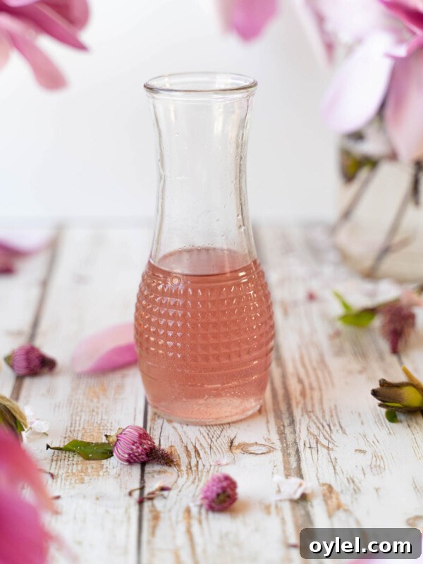 Magnolia flower syrup in a glass container