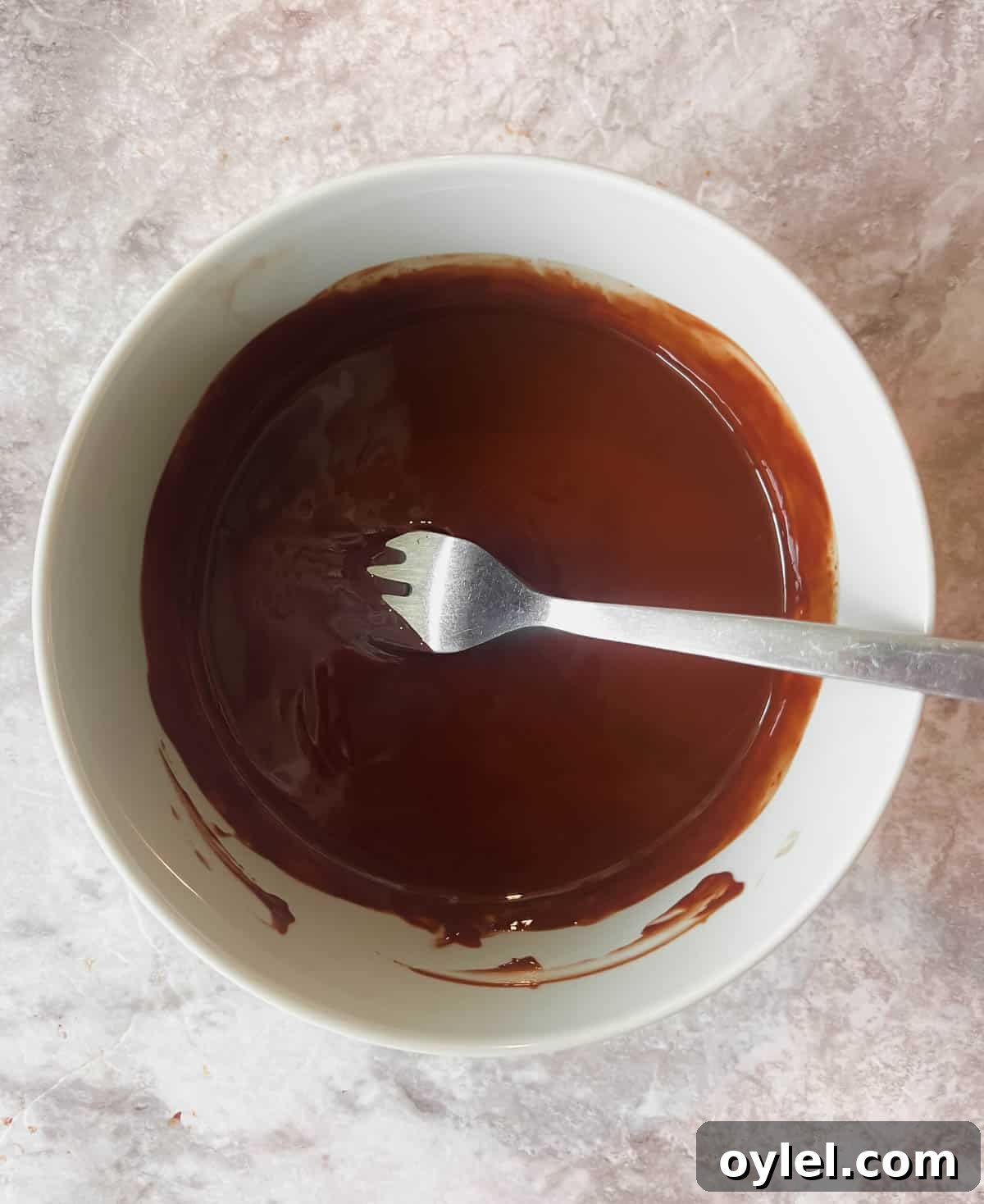 Melted chocolate mixed with coconut oil.
