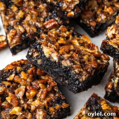Several pecan pie brownies scattered on a serving tray.