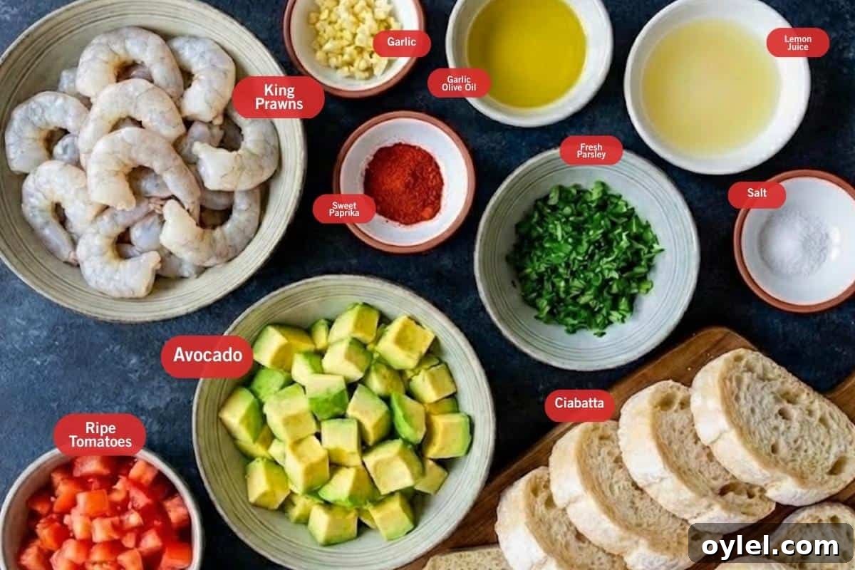 Flat lay photo of ingredient shot of king prawns, garlic, garlic olive oil, lemon juice, salt, ciabatta, fresh parsley, ripe tomatoes, avocado, sweet paprika