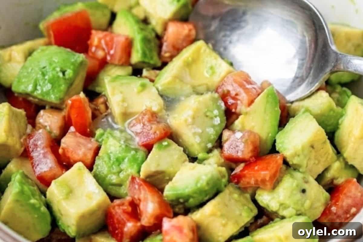 Combine the avocado, tomato, lemon juice, and salt in a bowl