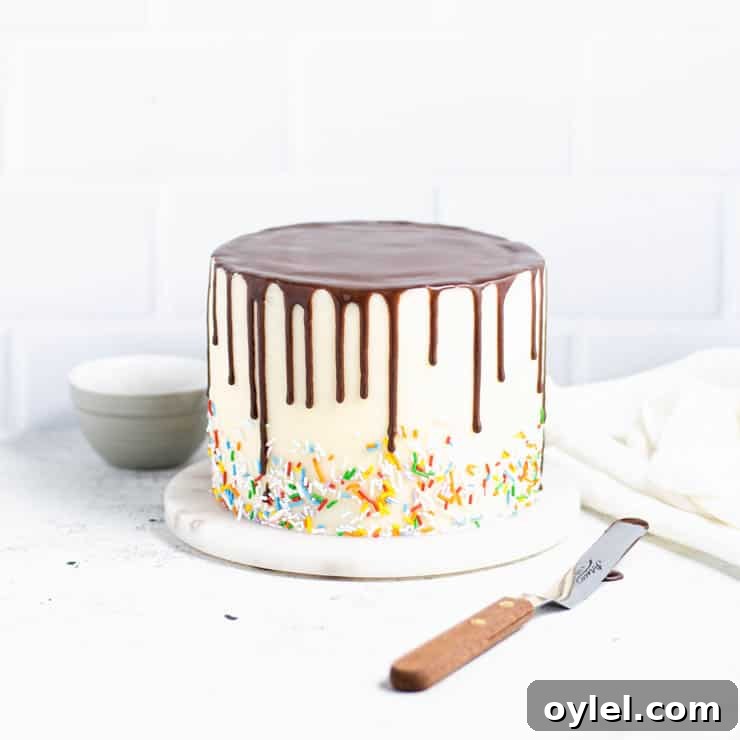 frosted cake with chocolate ganache drip