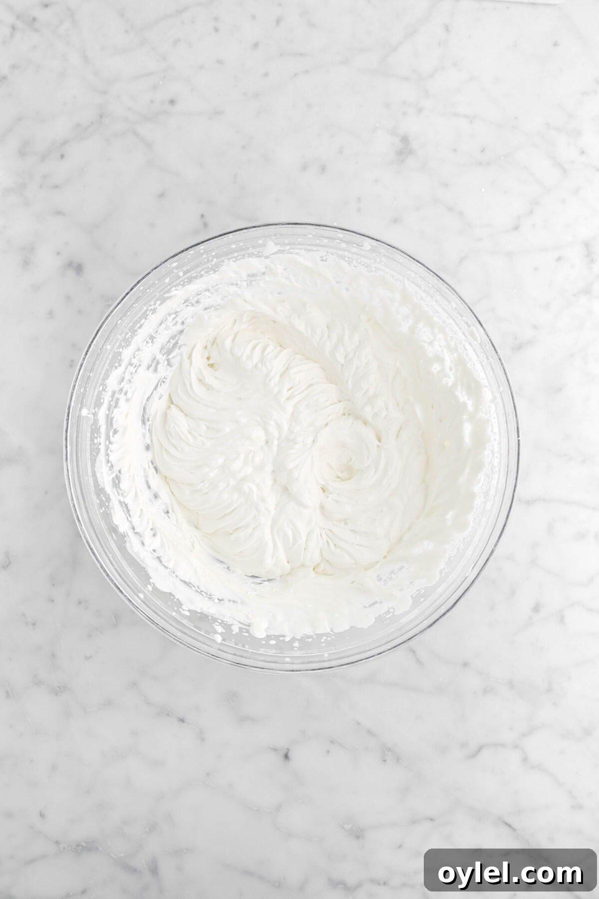 No-Bake Summer Berry and Ladyfinger Trifle Recipe 8 whipped cream in glass bowl.