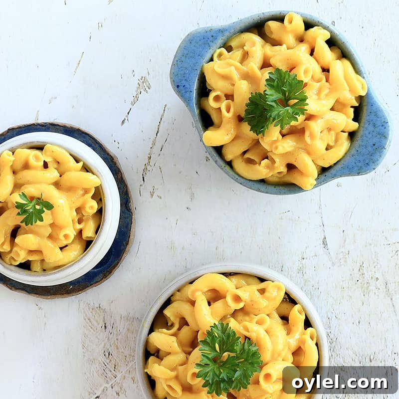 3 servings of vegan mac and cheese in bowls