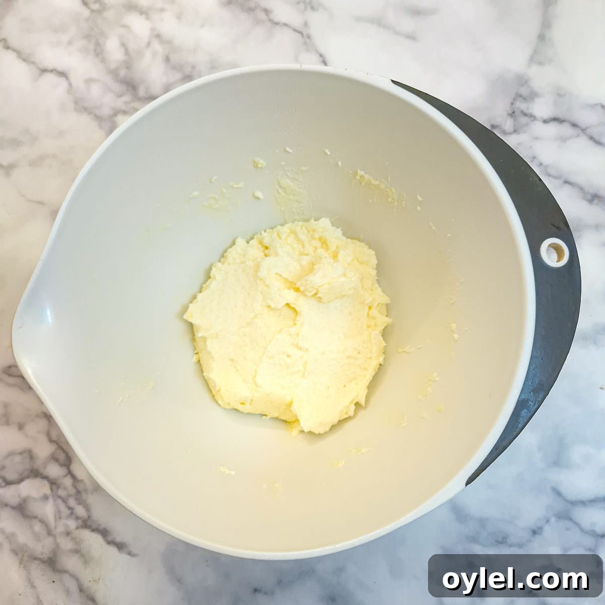 Eggs beaten into the butter and sugar.